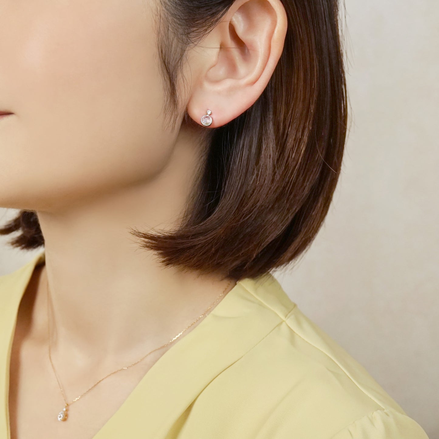 10K Sky Blue Topaz Stud Earrings (White Gold) - Model Image