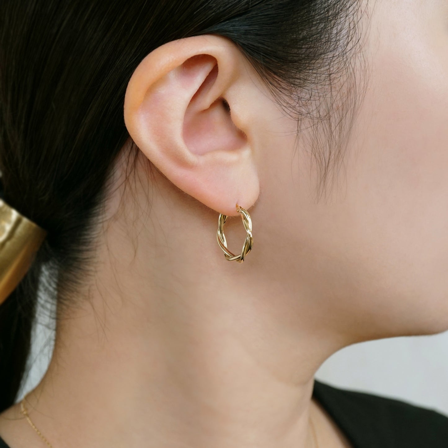 18K/10K Twisted Pipe Hoop Earrings (Yellow Gold) - Model Image