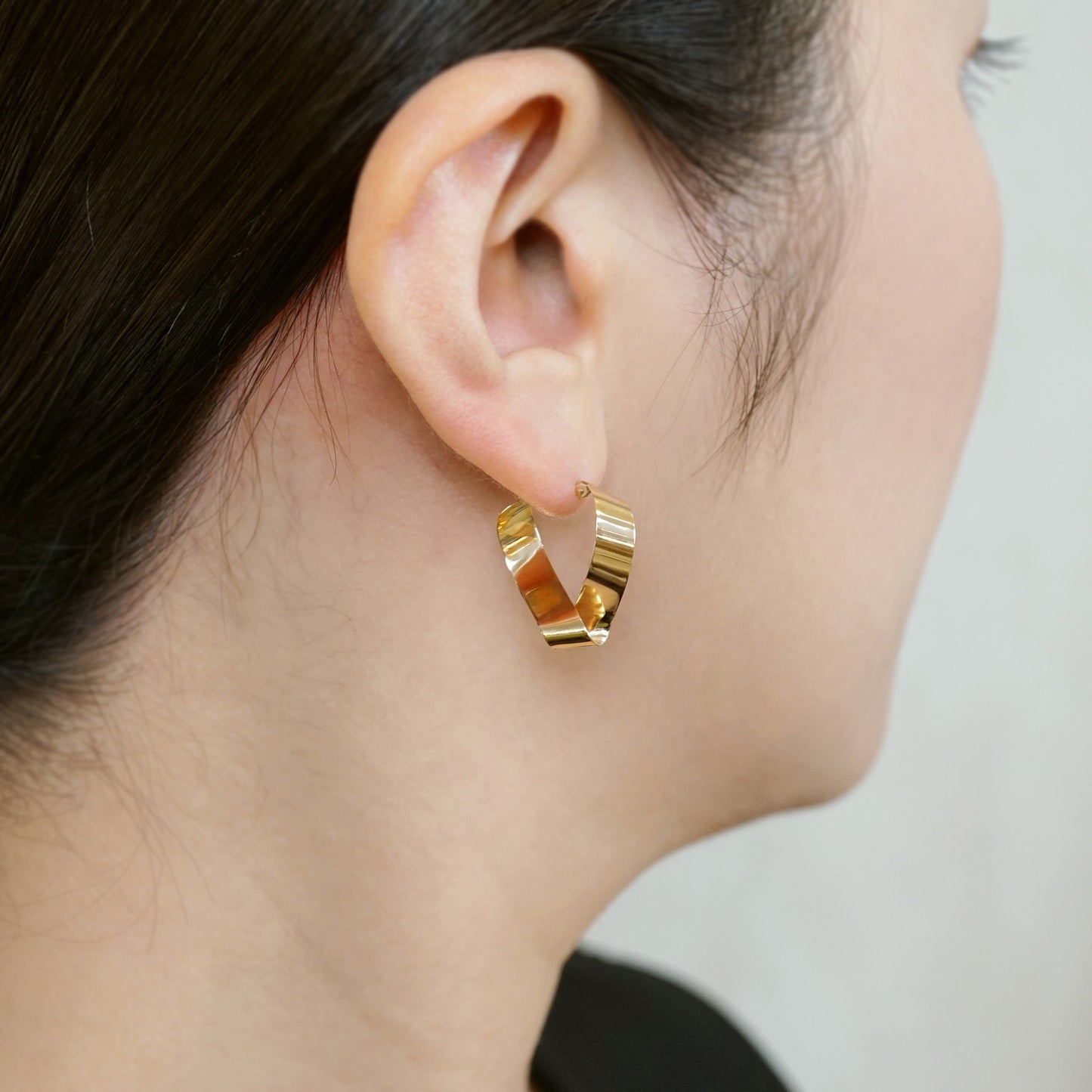 18K/10K Twisted Plate Hoop Earrings (Yellow Gold) - Model Image