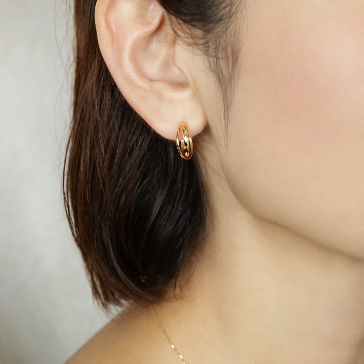 18K/10K Mixed Cut Double Hoop Earrings (Yellow Gold) - Model Image