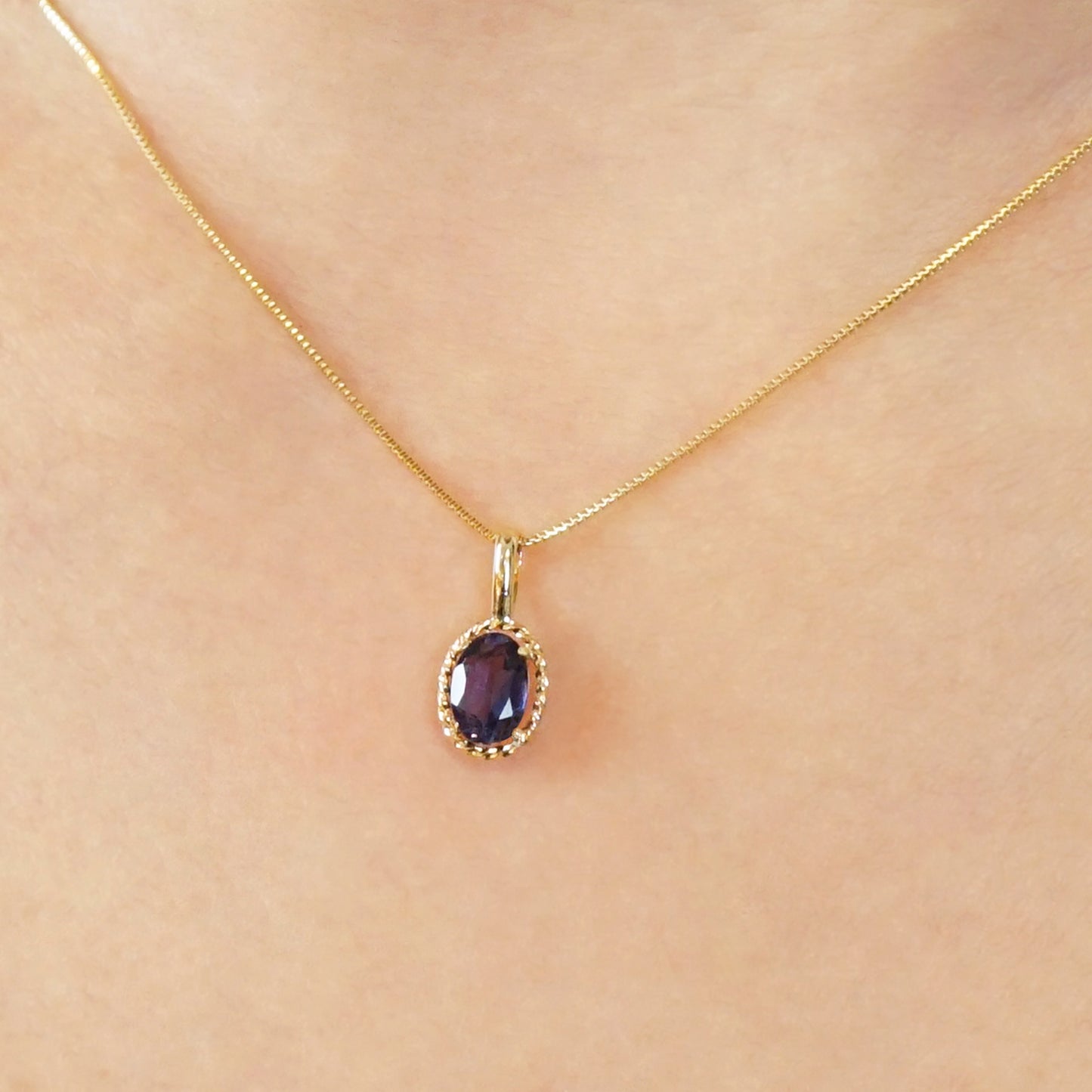 10K Iolite Oval Necklace Charm (Yellow Gold) - Model Image