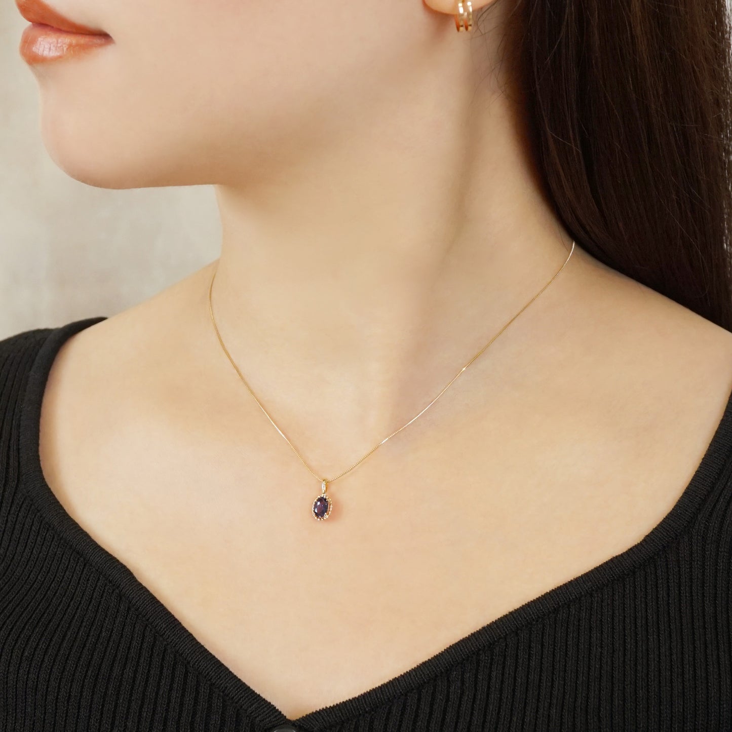 10K Iolite Oval Necklace Charm (Yellow Gold) - Model Image