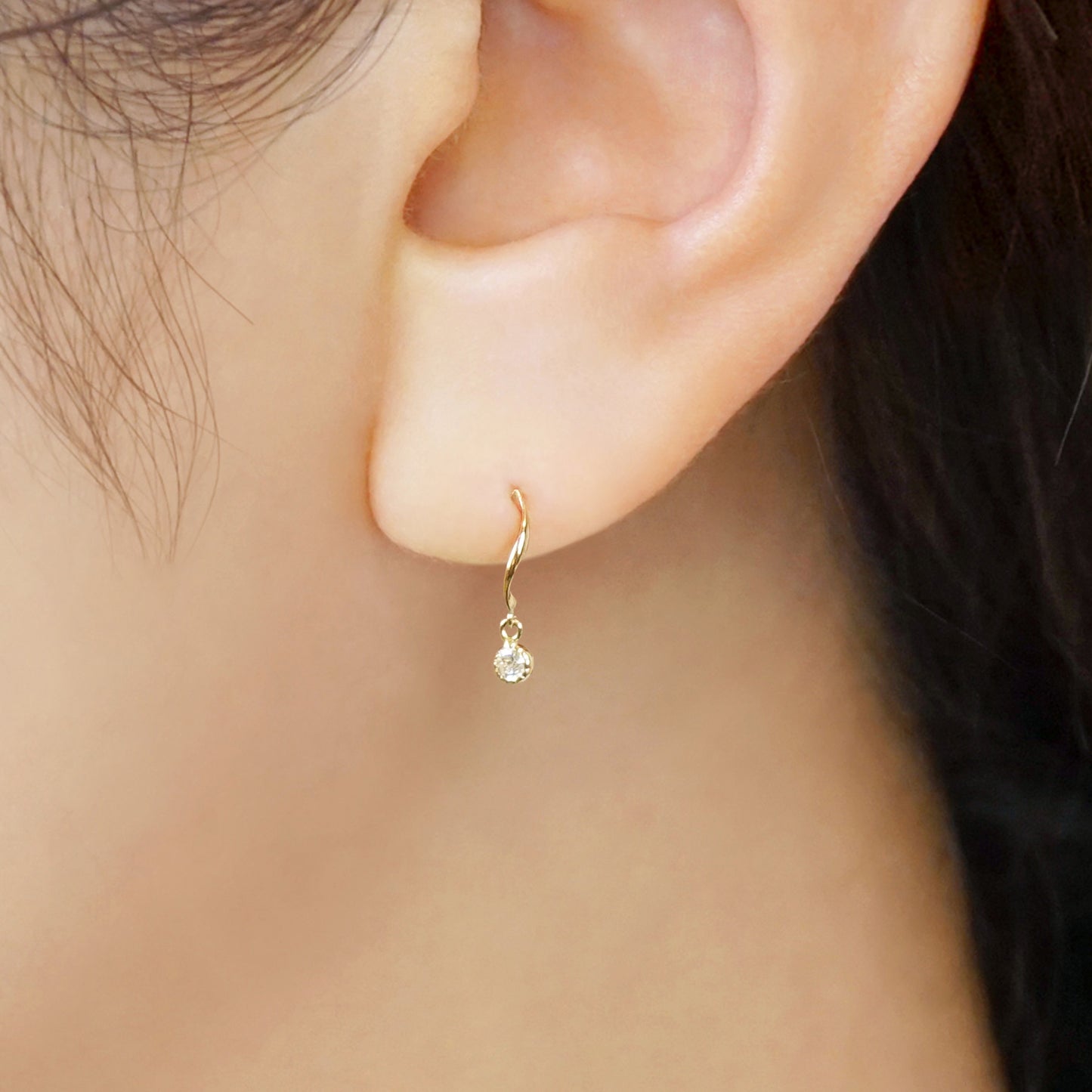 10K Twisted Line Swinging Earrings (Yellow Gold) - Model Image