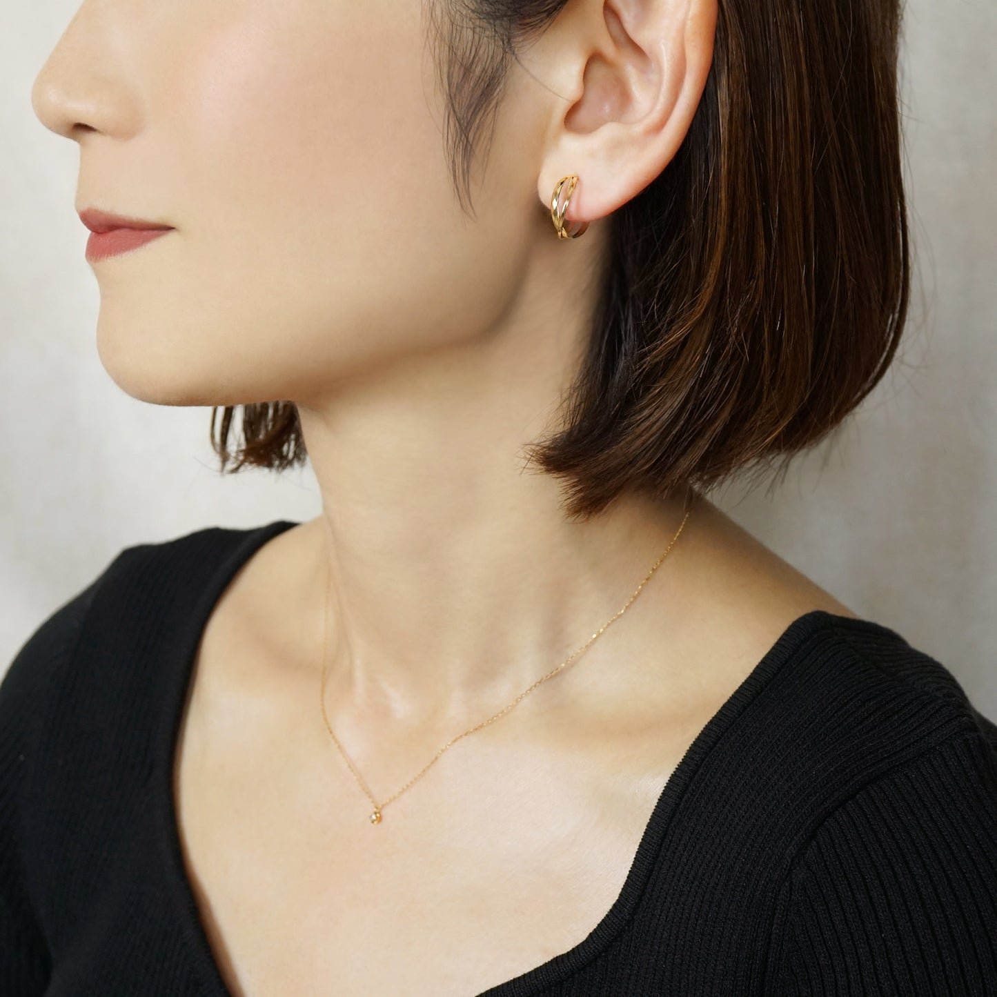 10K Mixed Cut Double Clip-On Hoop Earrings (Yellow Gold) - Model Image