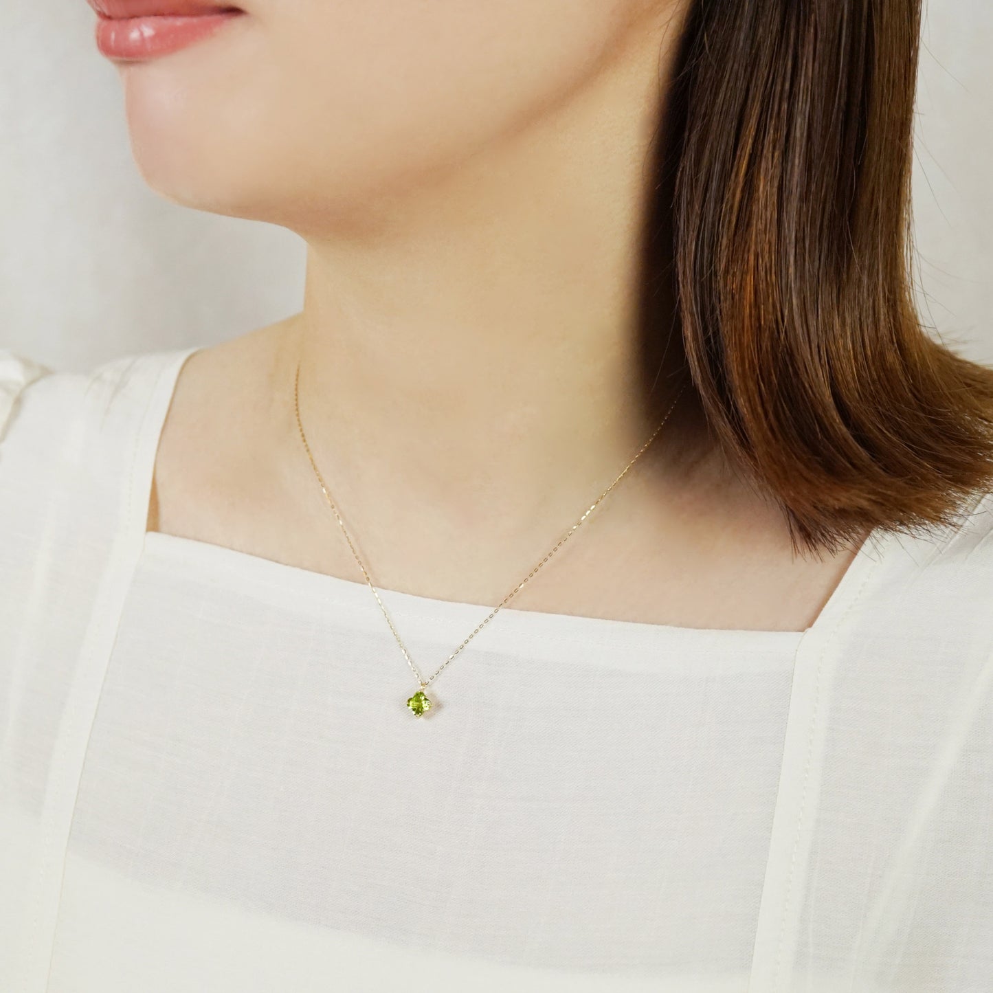 10K Peridot Lily Necklace (Yellow Gold) - Model Image