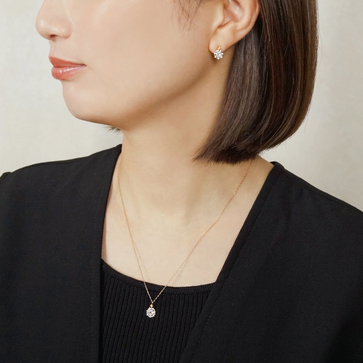 10K Sun Moissanite Earrings (Yellow Gold) - Model Image