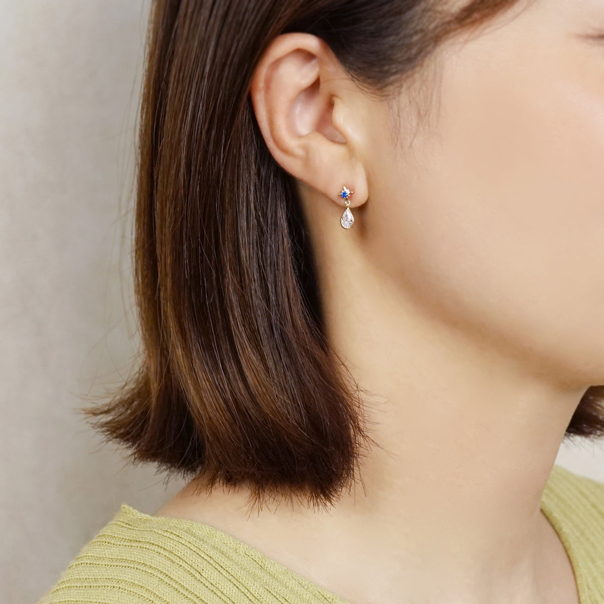 10K Star Swinging Dew Drop Earrings (Yellow Gold) - Model Image