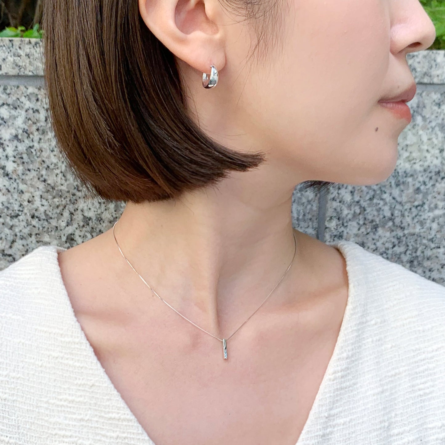 10K White Gold Ice Blue Diamond Bar Necklace - Model Image