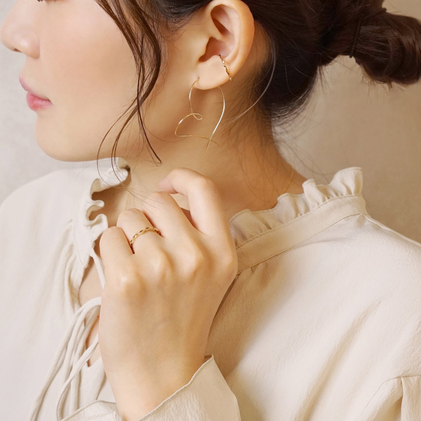 Gold Filled Twisted Heart Earrings (Large) - Model Image