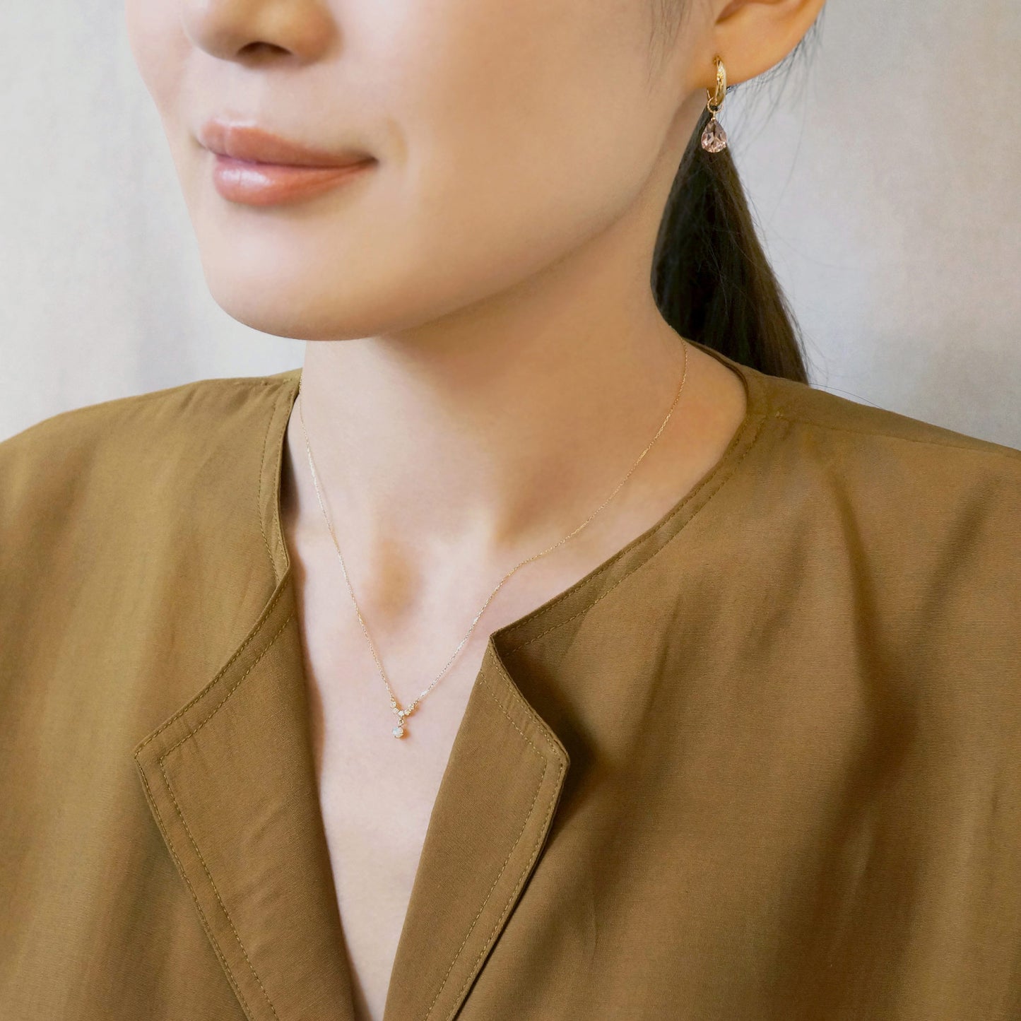 10K Yellow Gold Birthstone (Opal) Swinging Necklace - Model Image