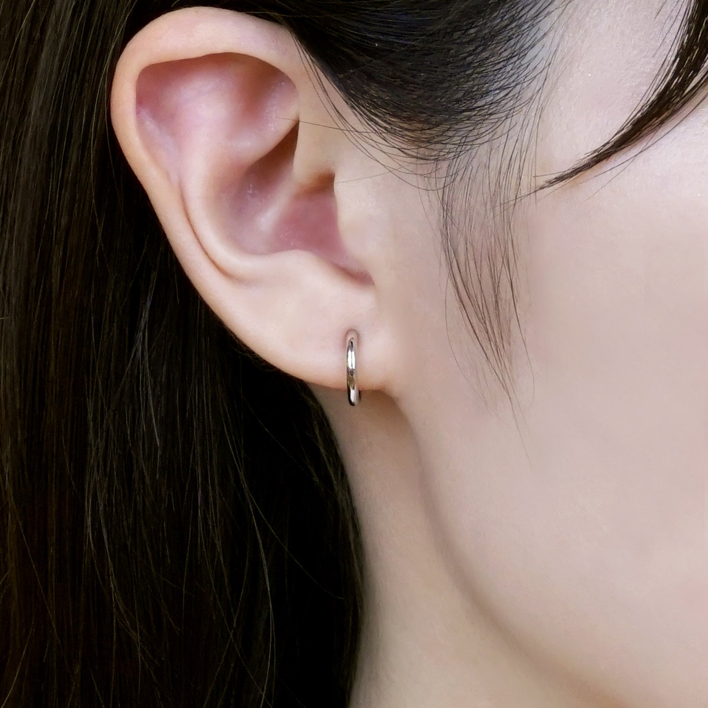 14K/10K White Gold Mini Hoop Earrings - Model Image