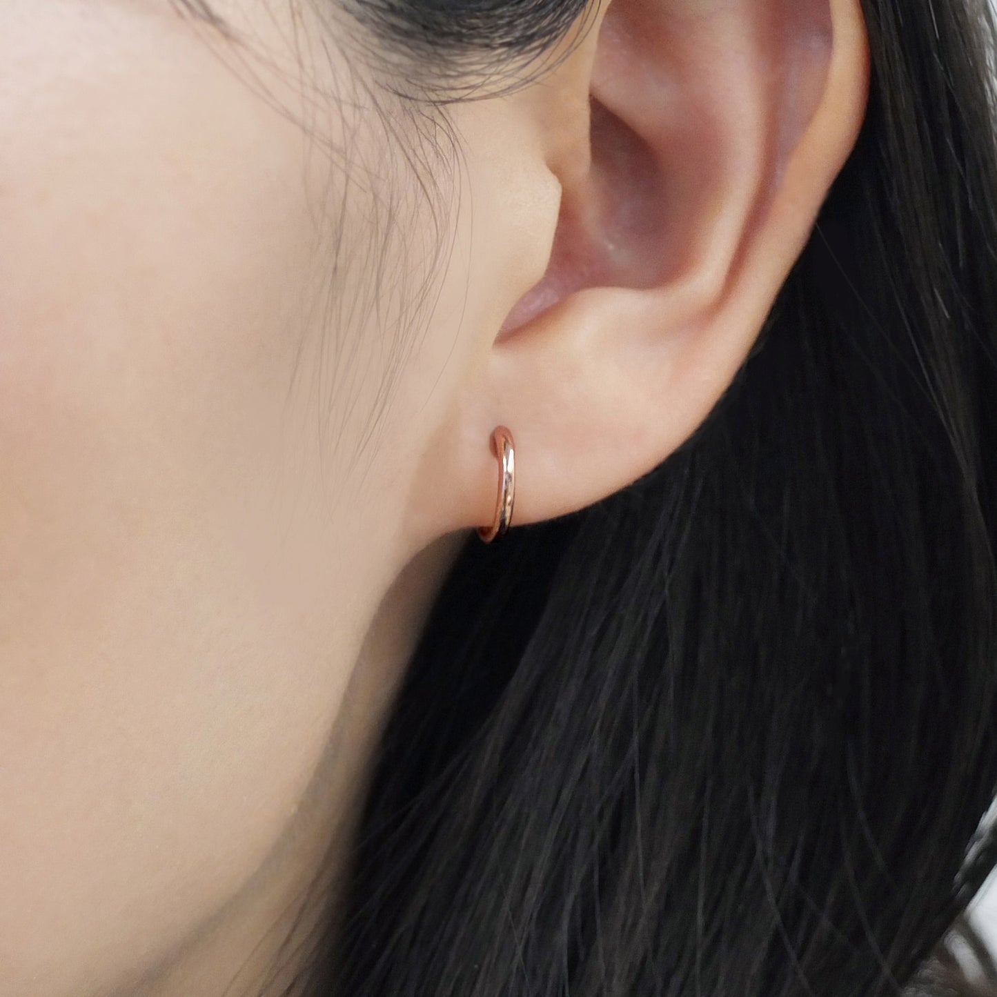 18K/10K Rose Gold Mini Hoop Earrings - Model Image