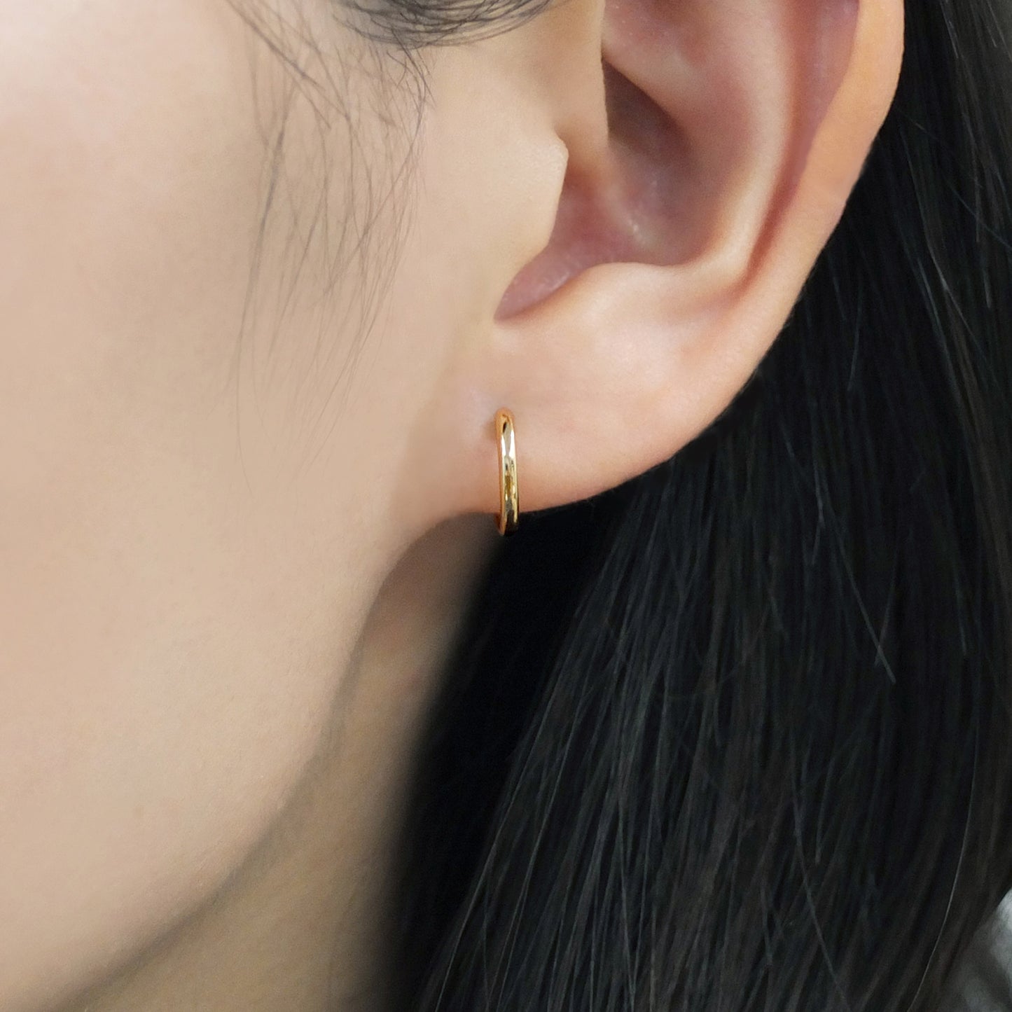 18K/10K Yellow Gold Mini Hoop Earrings - Model Image