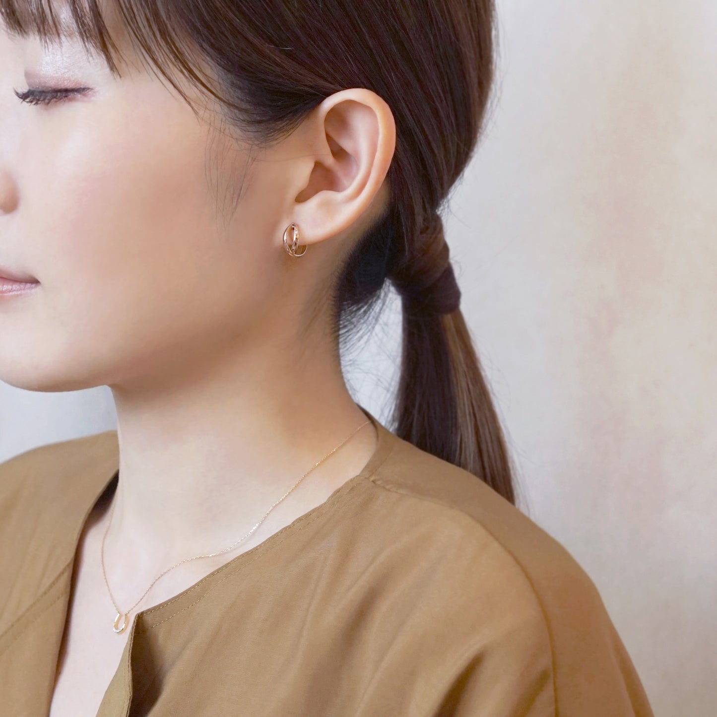 18K/10K Rose Gold Cross Hoop Earrings (Small) - Model Image