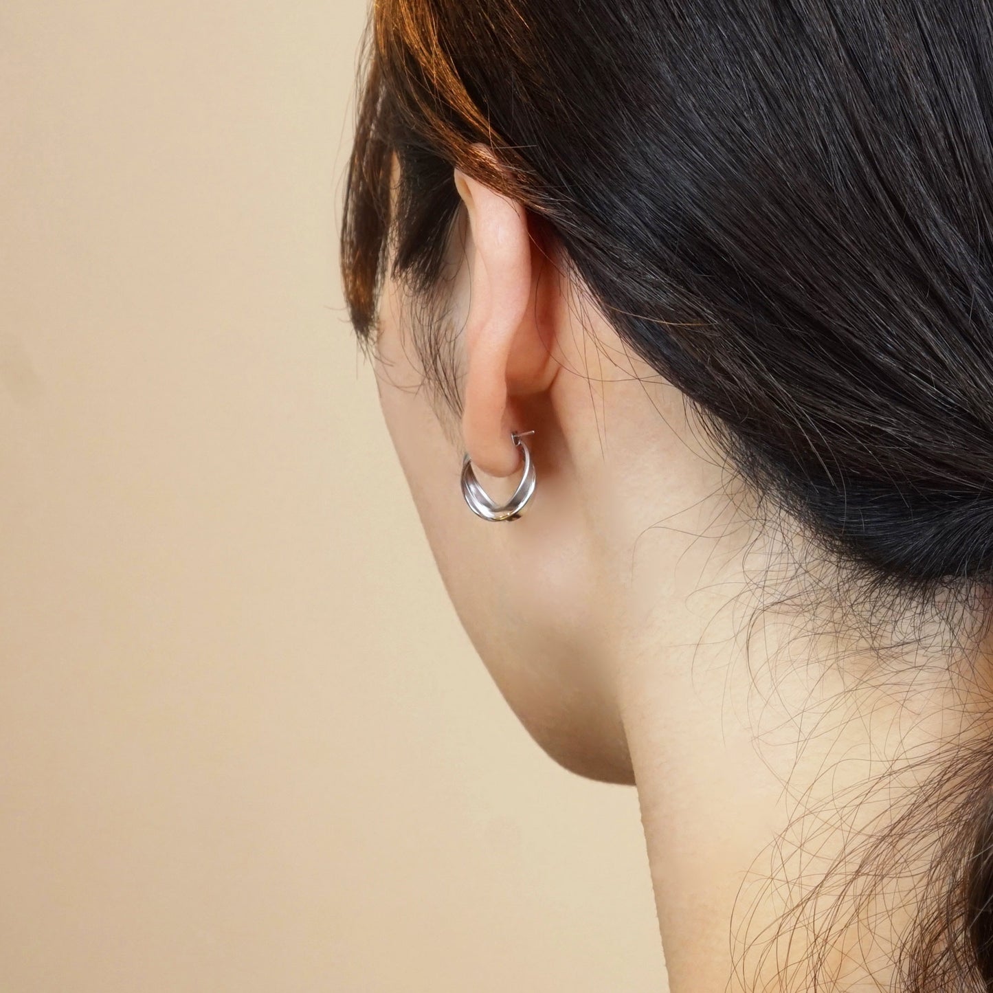 14K/10K White Gold Twisted Twin Hoop Earrings - Model Image