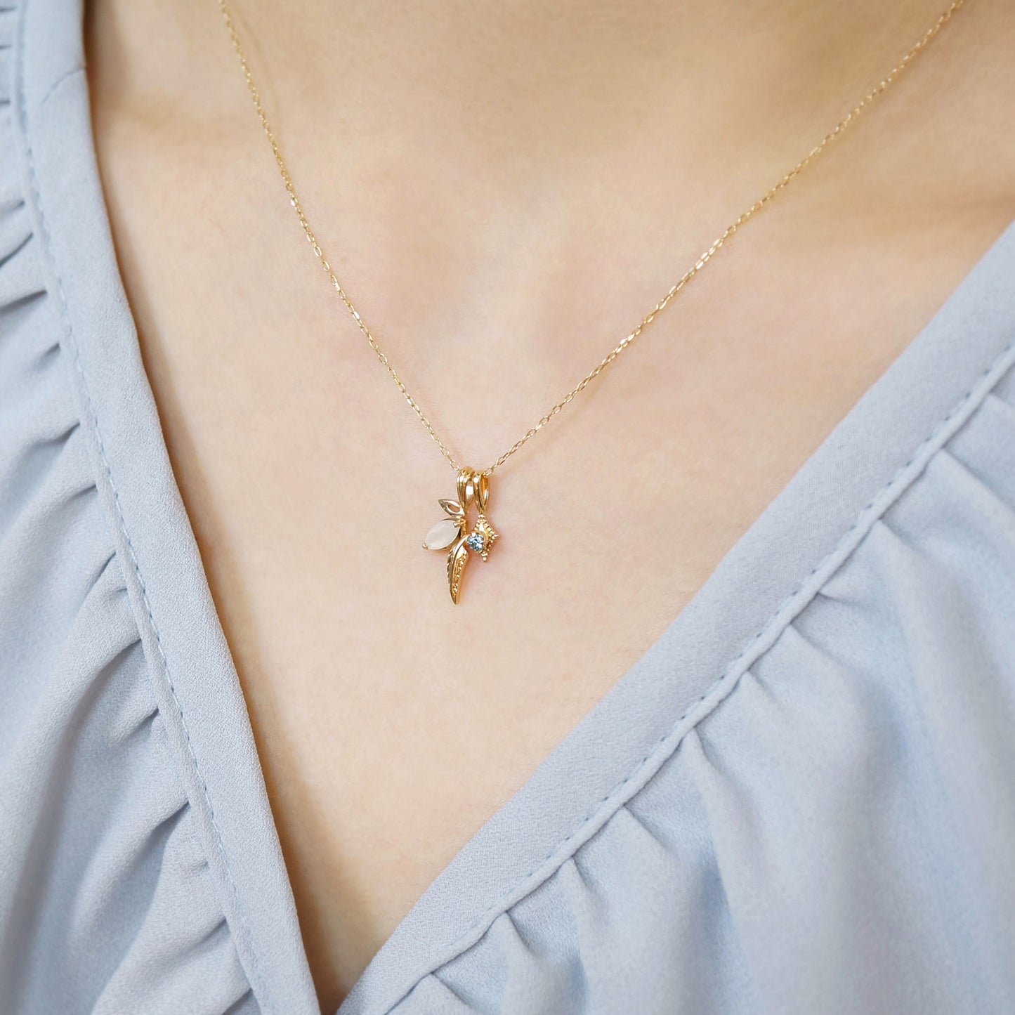 10K Moonstone x London Blue Topaz Necklace "Flutter" (Yellow Gold) - Model Image