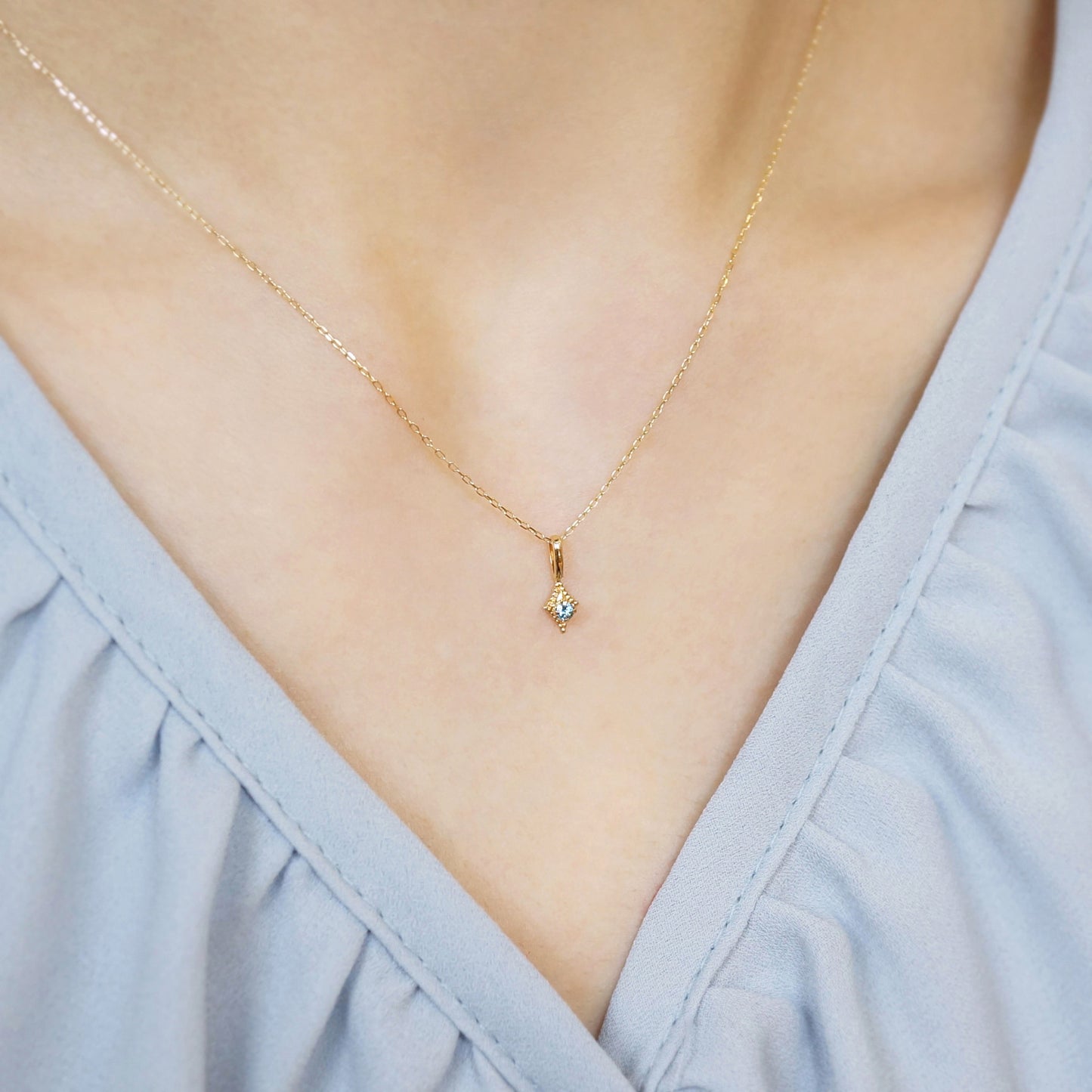 10K Moonstone x London Blue Topaz Necklace "Flutter" (Yellow Gold) - Model Image