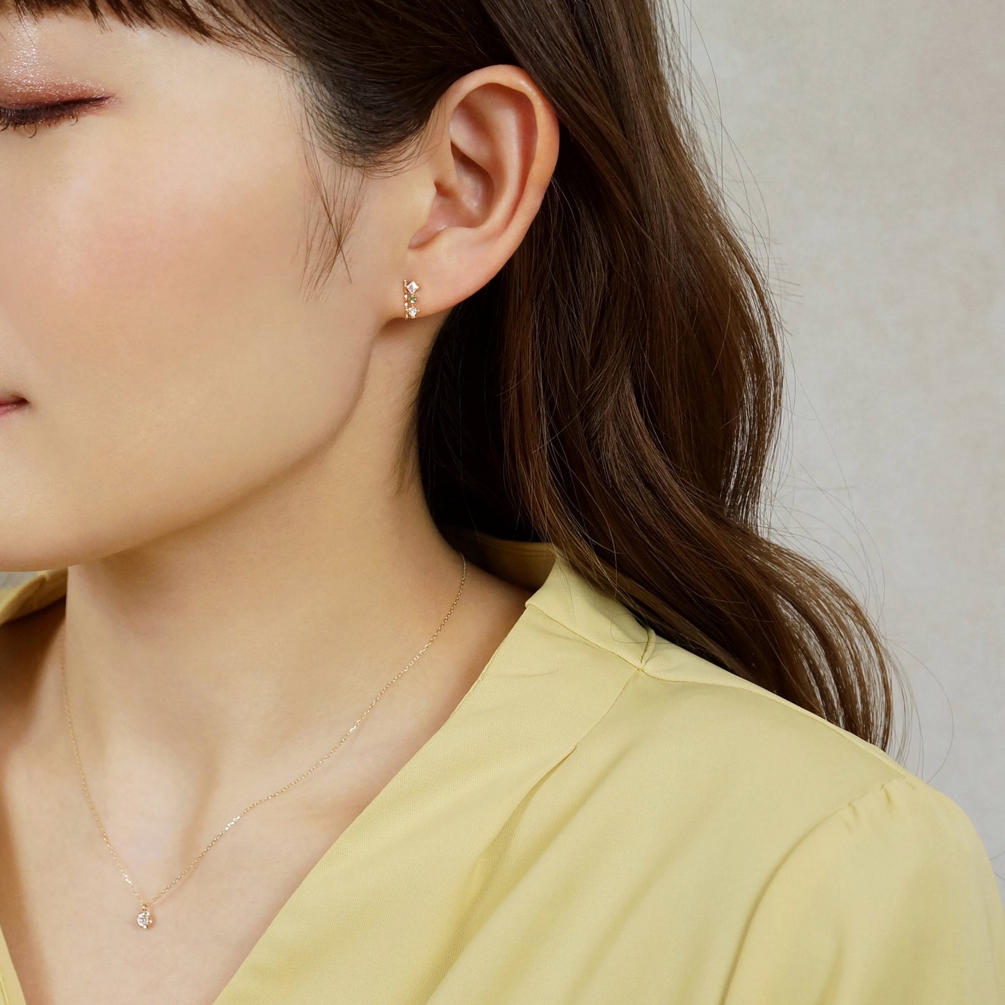 18K/10K Yellow Gold Emerald 3-Stone Bar Earrings - Model Image