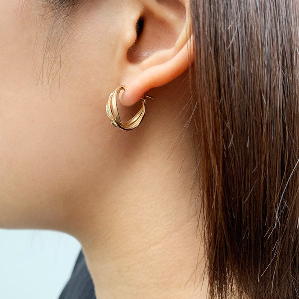 18K/10K Yellow Gold Twisted Twin Hoop Earrings - Model Image