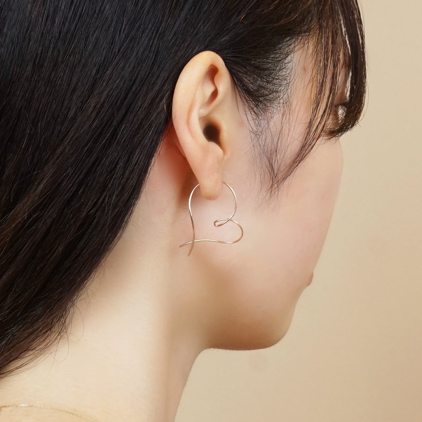 Gold Filled Twisted Heart Earrings - Model Image