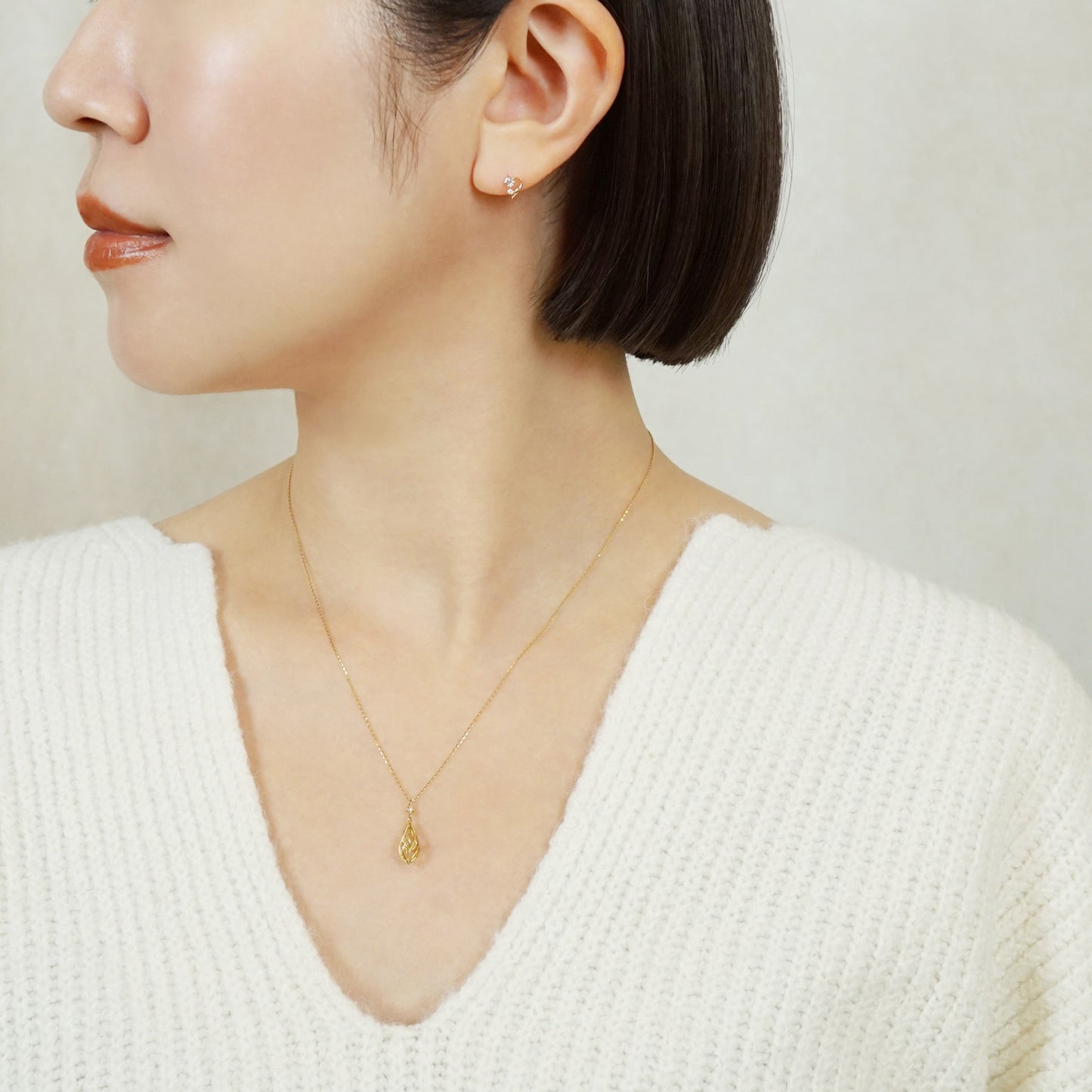 18K/10K Diamond Twisted Line Earrings (Yellow Gold) - Model Image