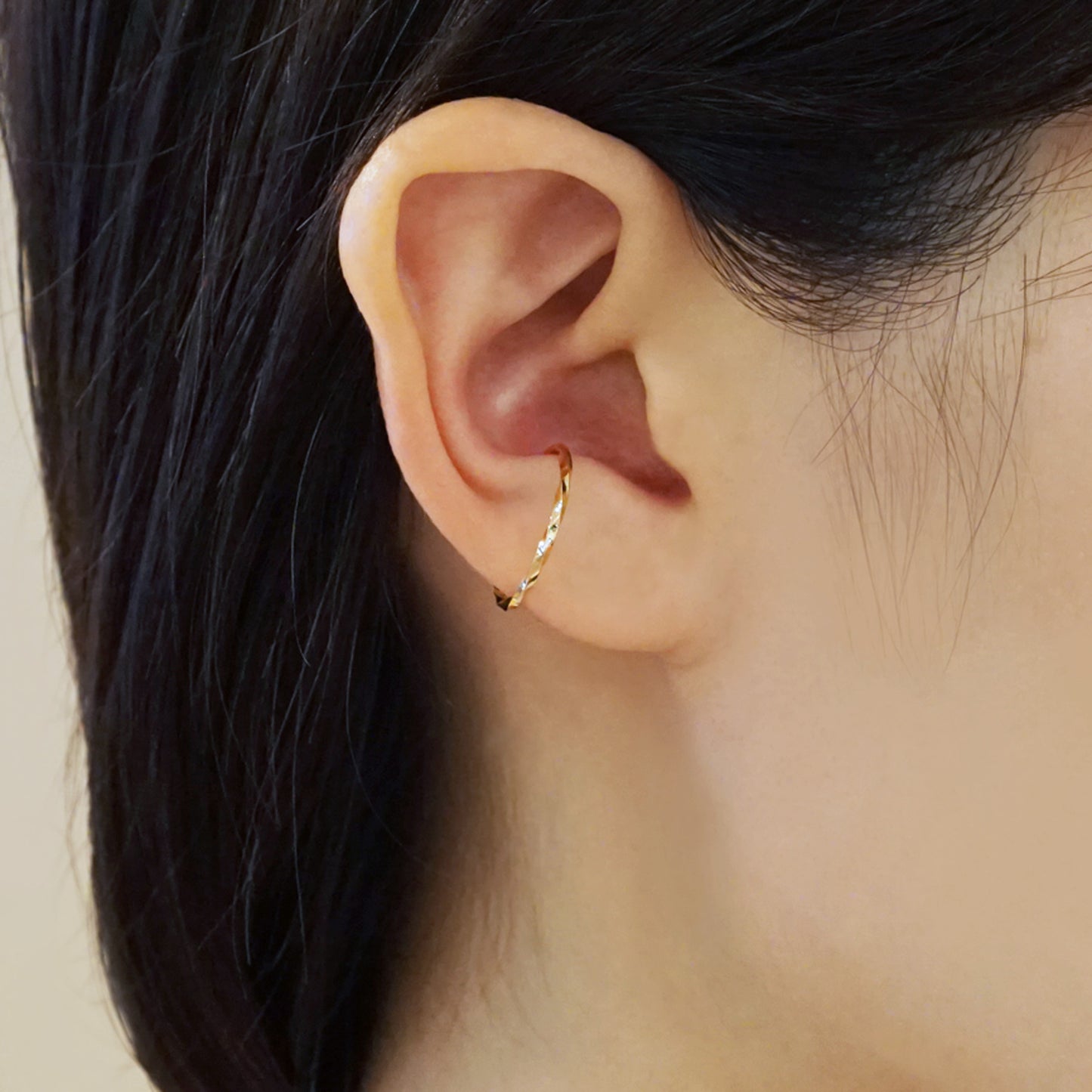 10K Yellow Gold Glittering Wave Ear Cuff - Model Image