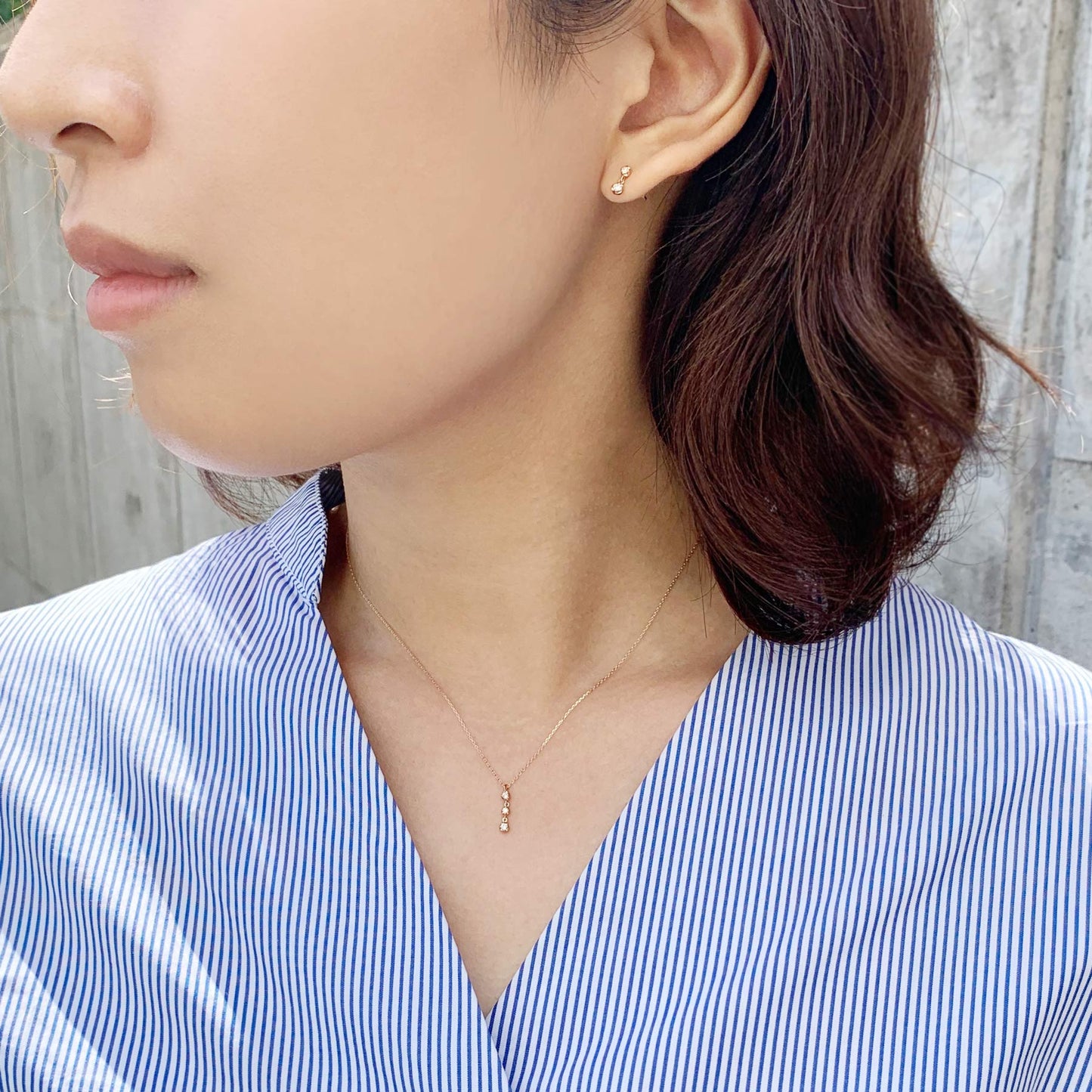 10K Rose Gold Diamond Trilogy Necklace - Model Image