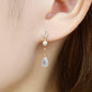18K/10K Blue Moonstone Dew Drop Swinging Earrings (Yellow Gold) - Model Image