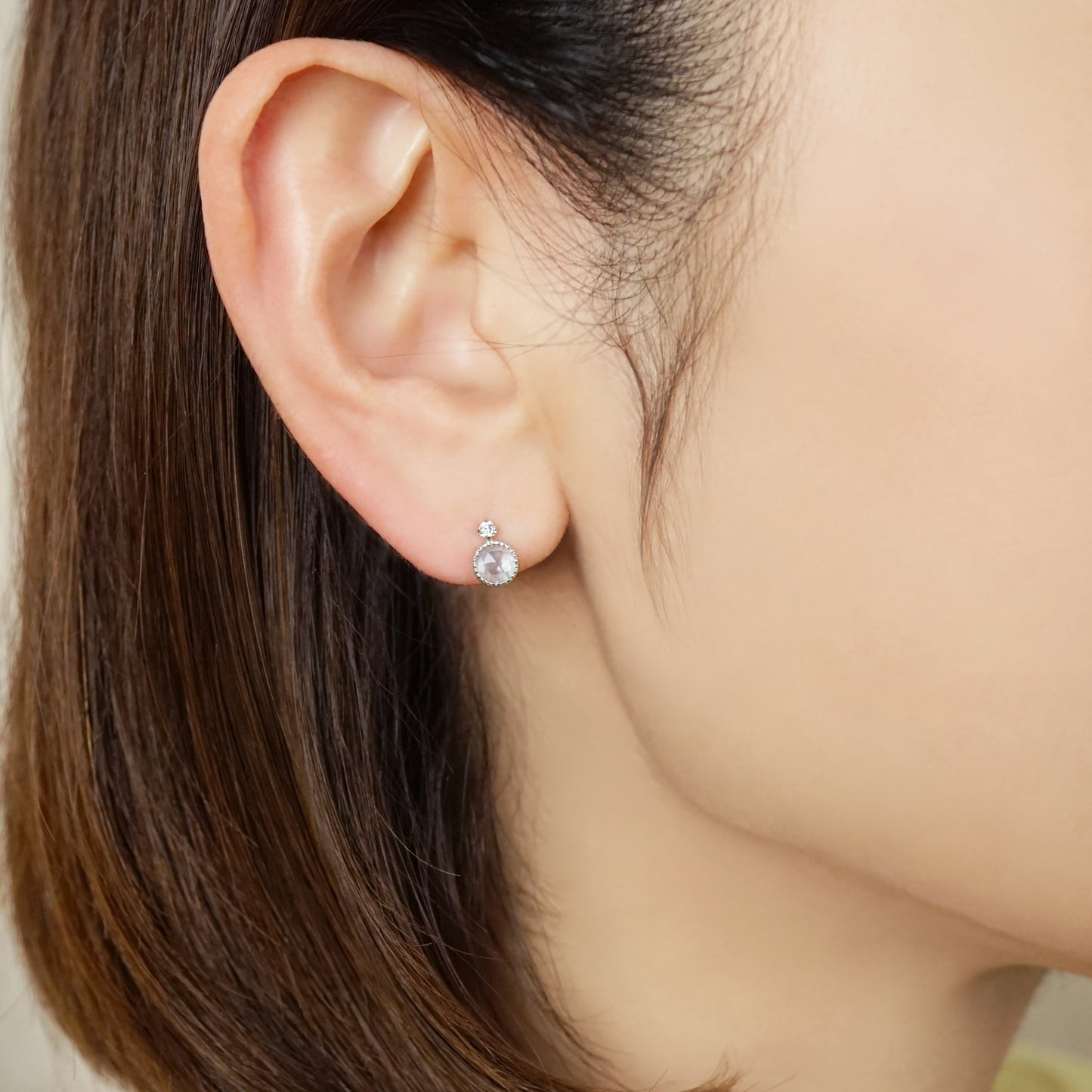 10K Sky Blue Topaz Stud Earrings (White Gold) - Model Image