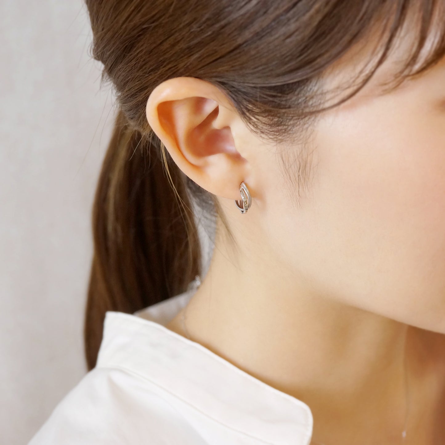 Platinum Twisted Twin Hoop Earrings - Model Image