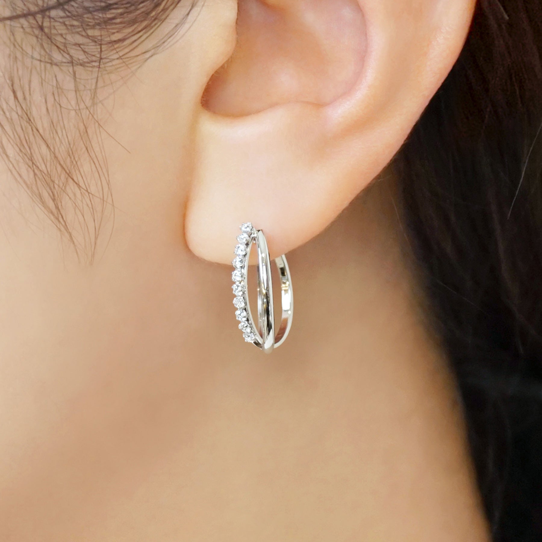 14K/10K Cubic Zirconia Oval Hoop Earrings (White Gold) - Model Image