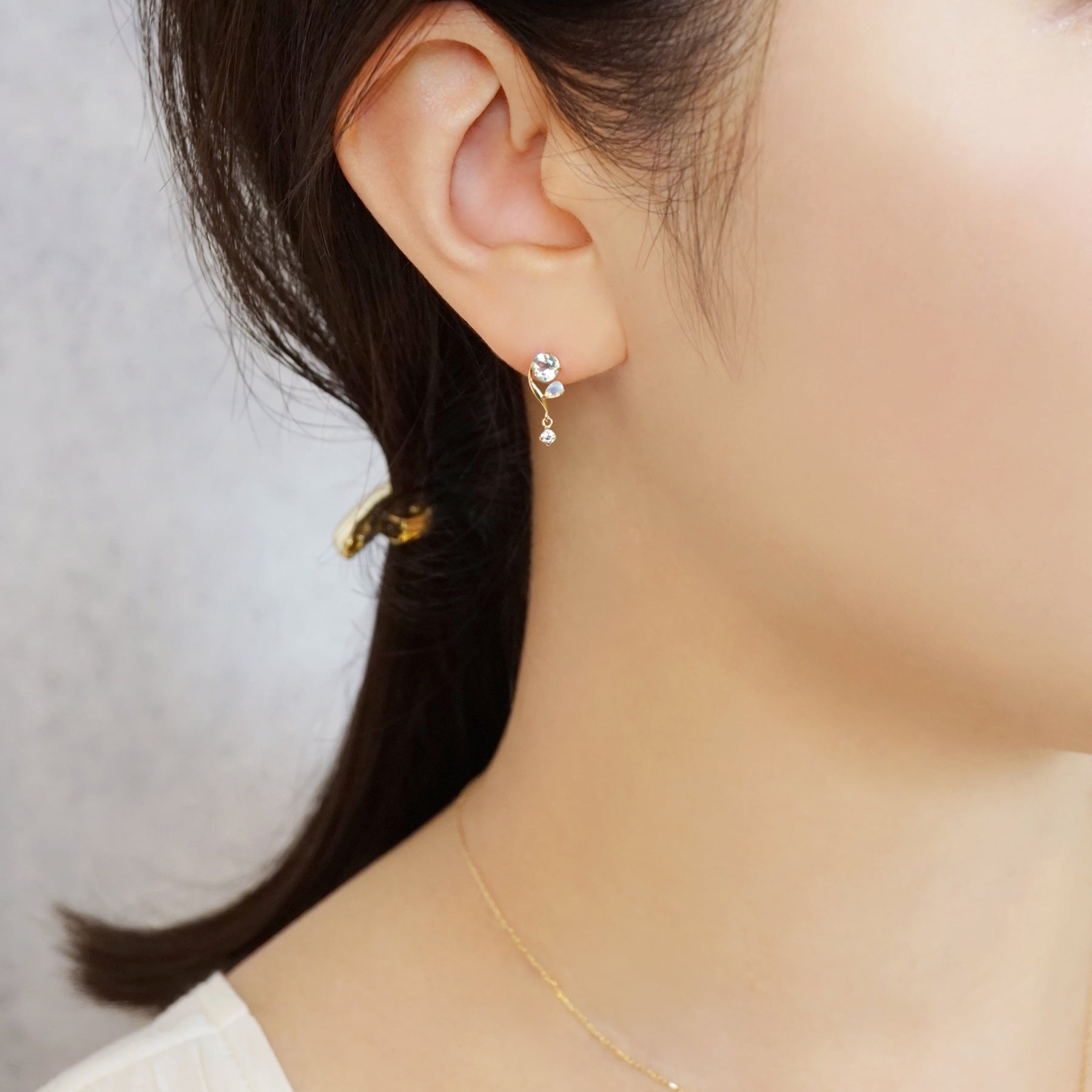 18K/10K Blue Topaz Twisted Line Swinging Earrings (Yellow Gold) - Model Image