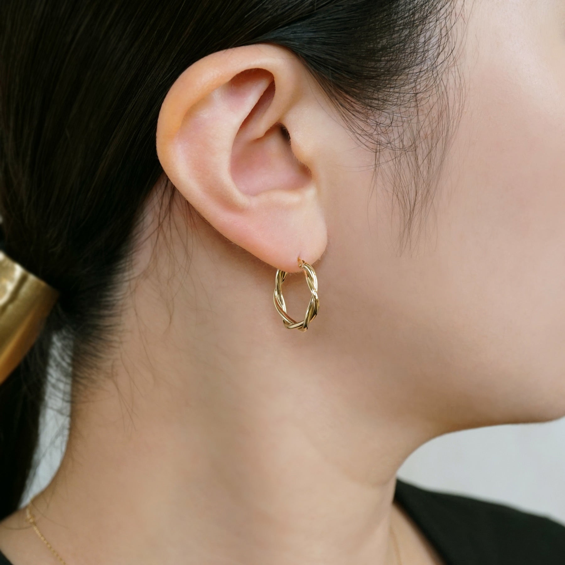 18K/10K Twisted Pipe Hoop Earrings (Yellow Gold) - Model Image