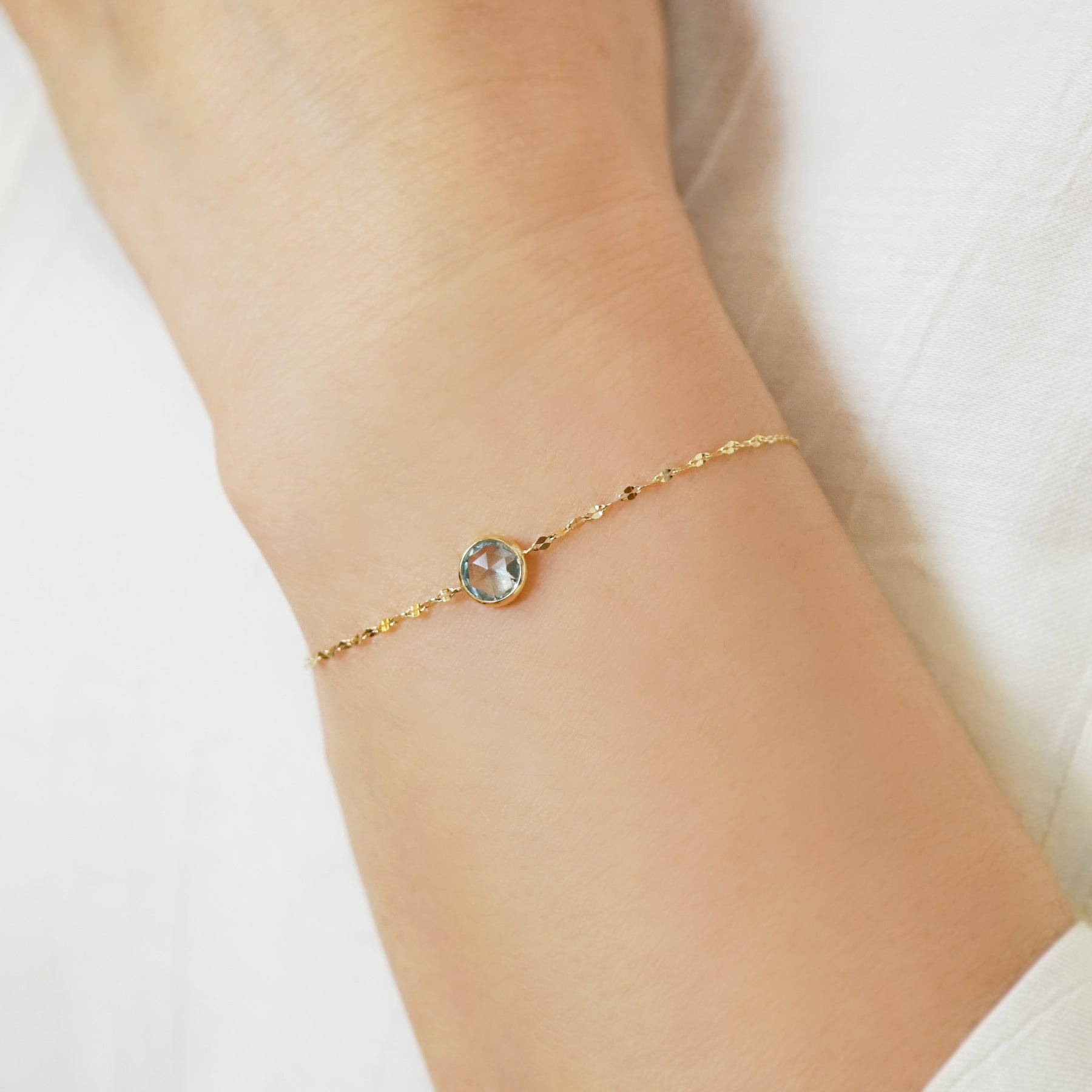 10K Blue Topaz Bracelet [Luminous Flow] (Yellow Gold) - Model Image