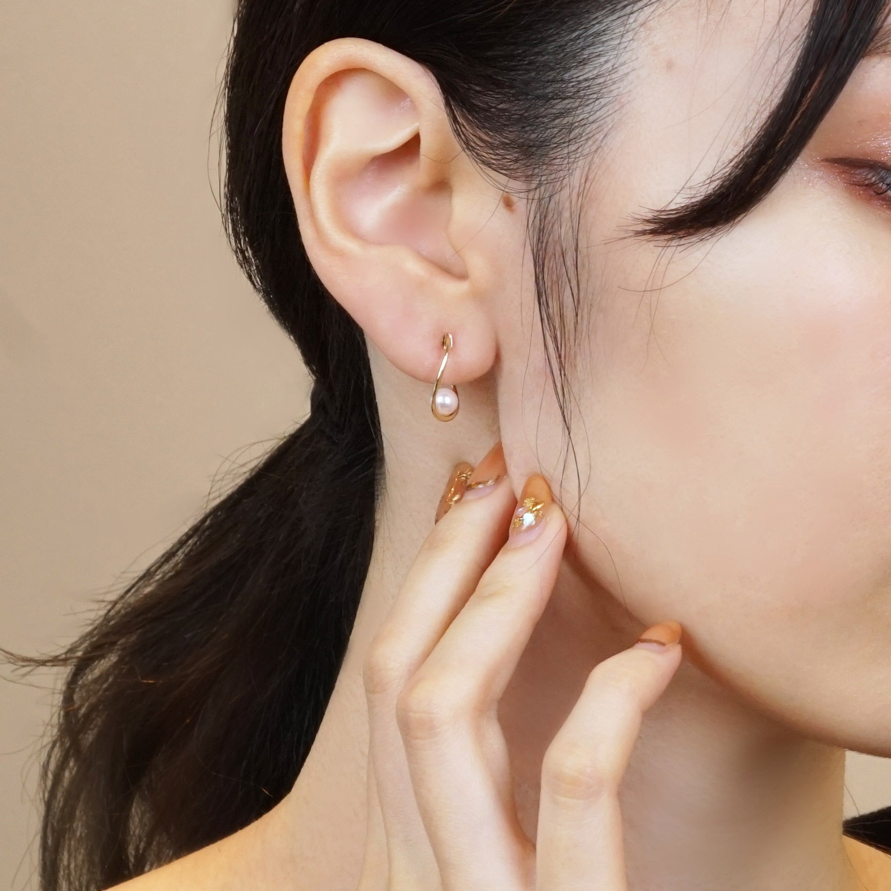 10K Yellow Gold Akoya Pearl Twist Hoop Clip-On Earrings - Model Image