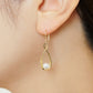 18K/10 Akoya Pearl Infinity Design Earrings (Yellow Gold) - Model Image