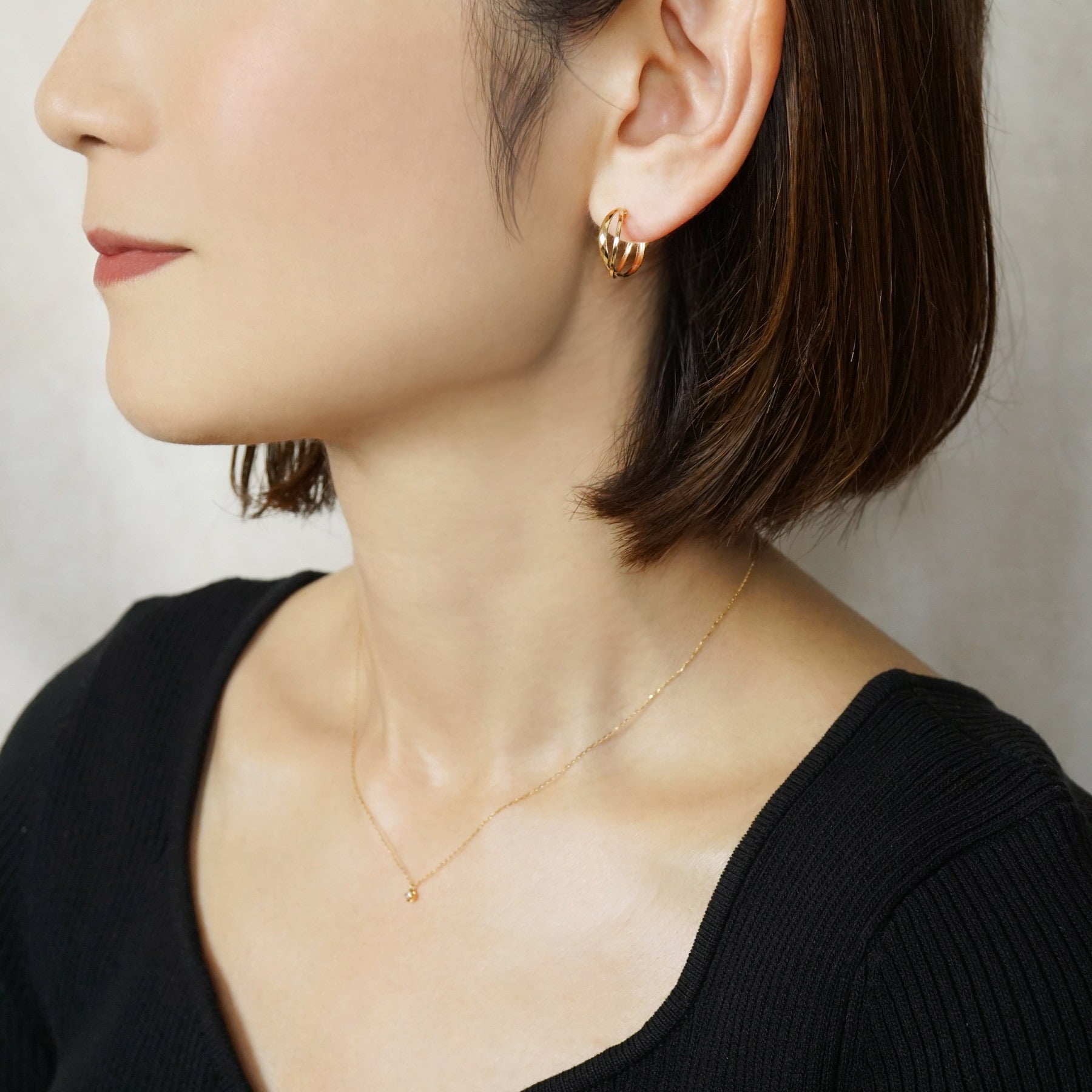 18K/10K Mixed Cut Double Hoop Earrings (Yellow Gold) - Model Image
