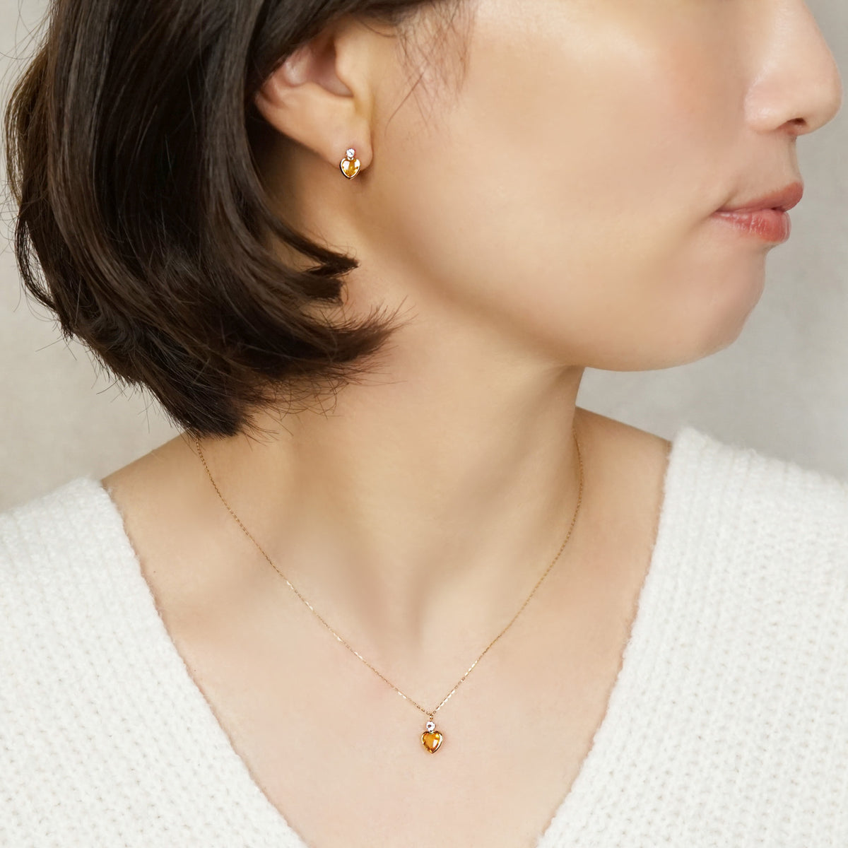 10K Citrine Heart Love Earrings (Yellow Gold) - Model Image