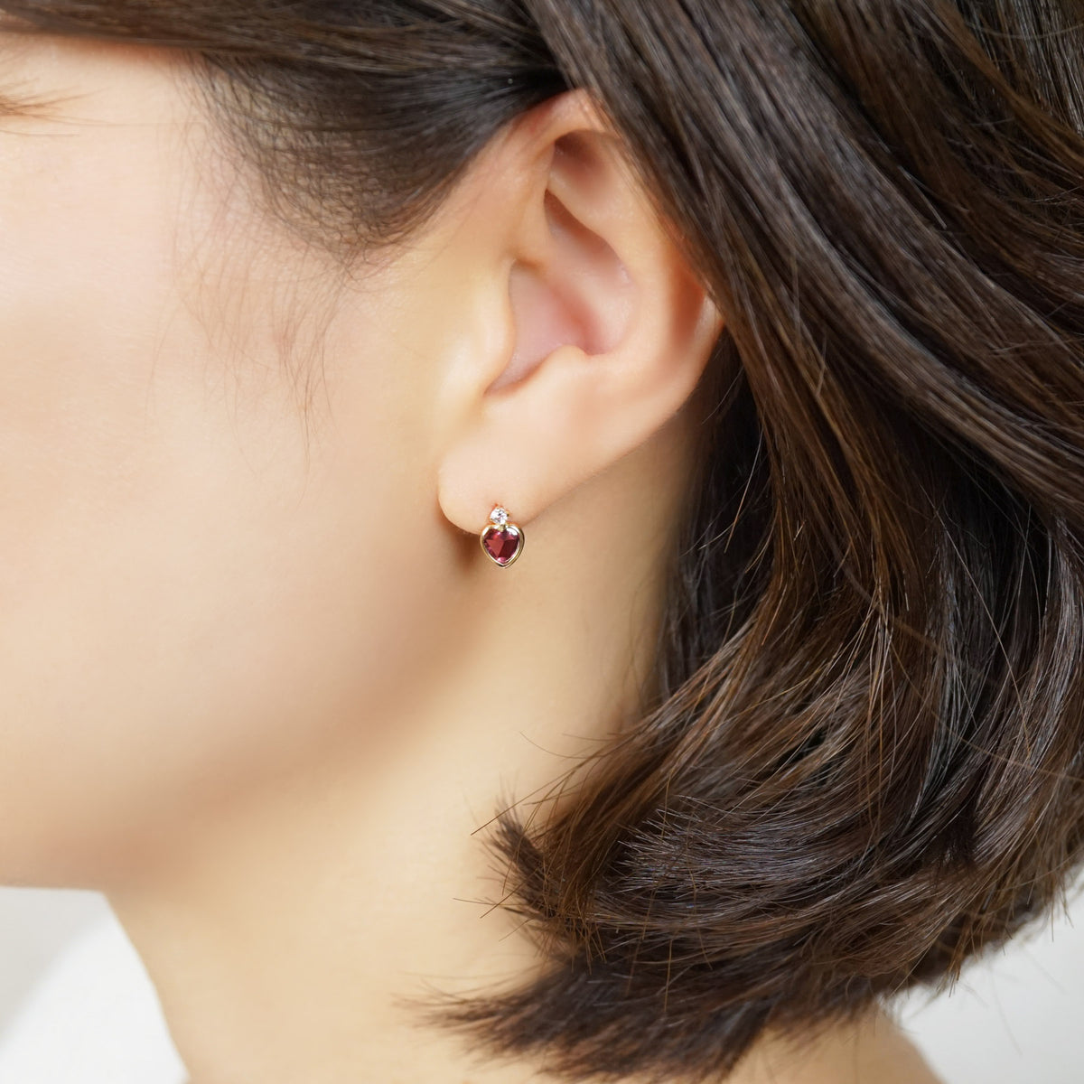 10K Rhodolite Garnet Heart Love Earrings (Yellow Gold) - Model Image