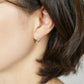 10K Sky Blue Topaz Heart Love Earrings (Yellow Gold) - Model Image