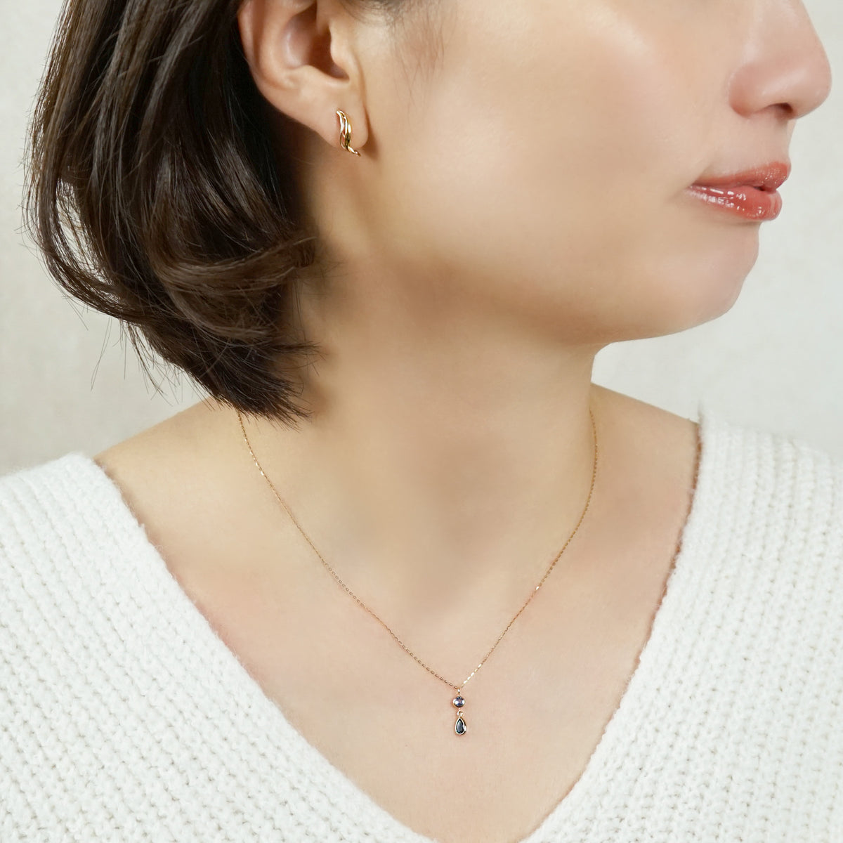 10K Blue Topaz Dew Drop Swinging Necklace (Yellow Gold) - Model Image