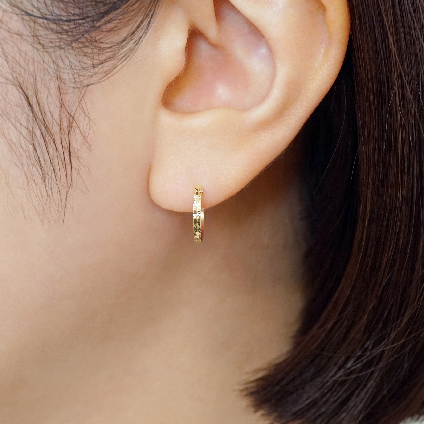 18K/10K Flower Cut Slender Hoop Earrings (Yellow Gold) - Model Image