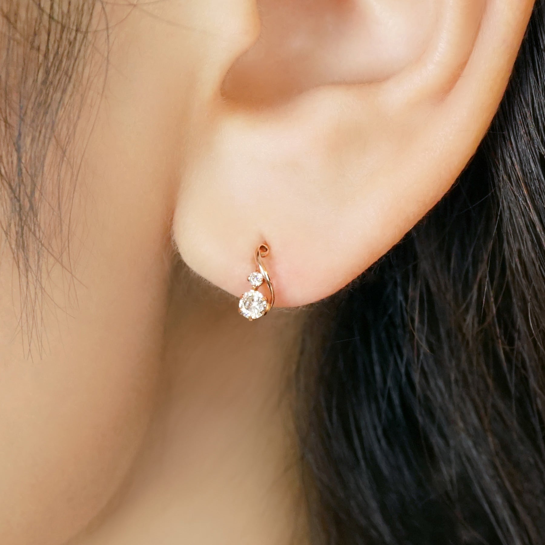 10K Twisted Line Stud Earrings (Rose Gold) - Model Image