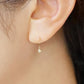 10K Twisted Line Swinging Earrings (Yellow Gold) - Model Image