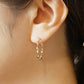 18K/10K Twisted Ribbon Hoop Earrings (Yellow Gold) - Model Image