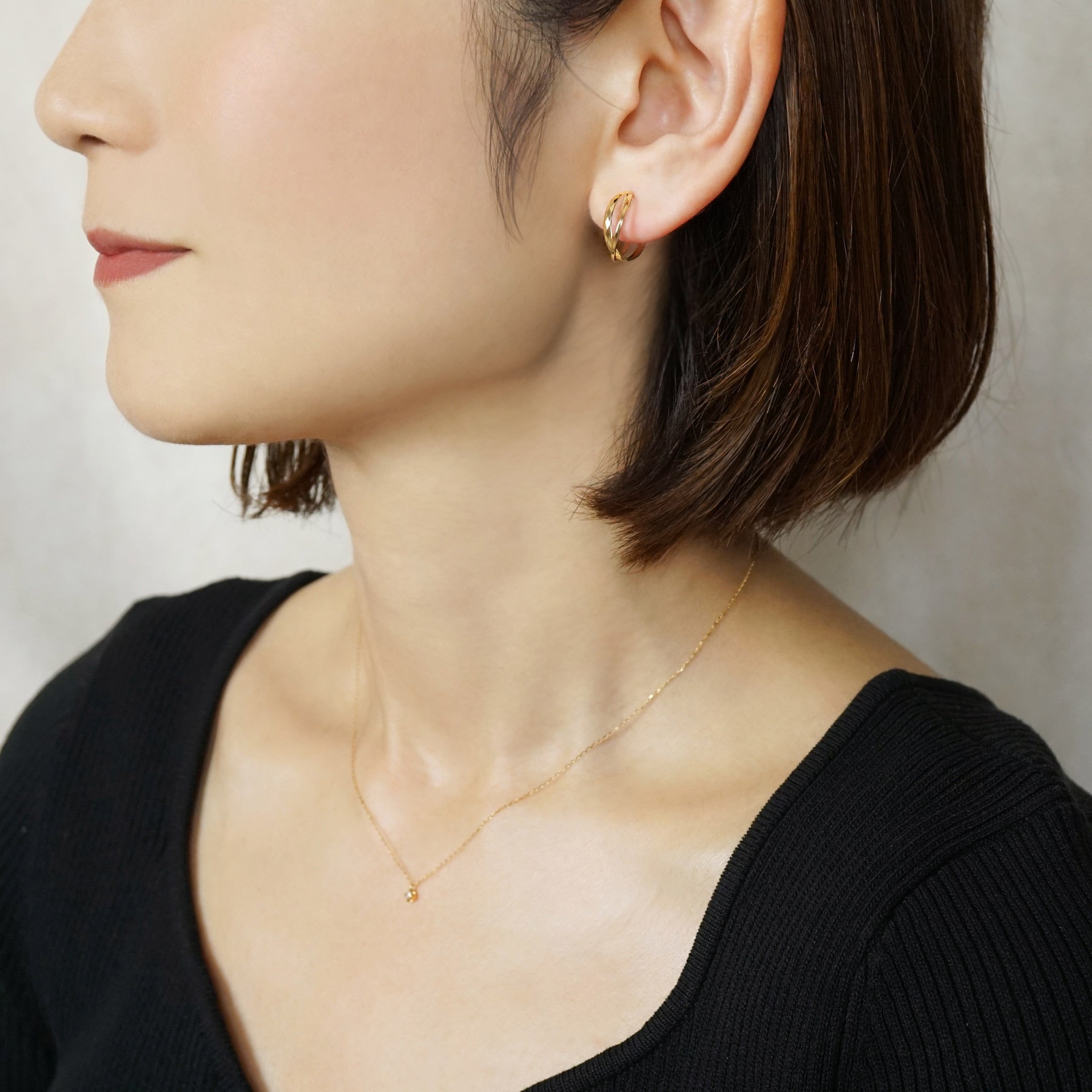 10K Mixed Cut Double Clip-On Hoop Earrings (Yellow Gold) - Model Image