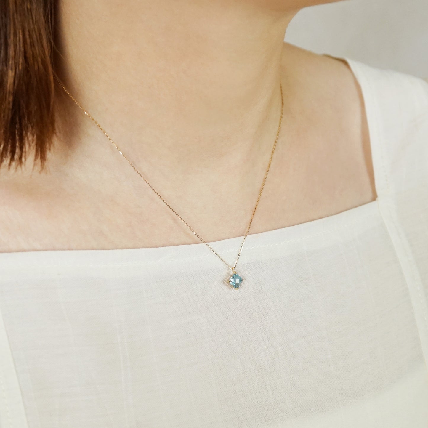 10K Blue Topaz Lily Necklace (Yellow Gold) - Model Image