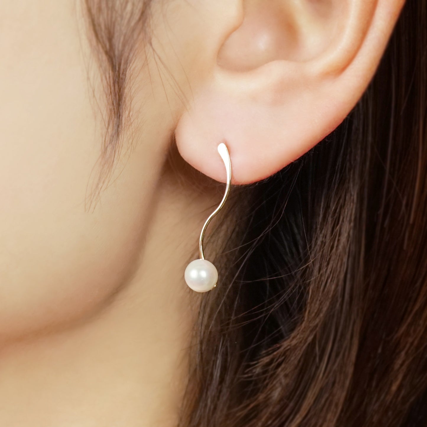 10K Akoya Pearl S-shaped Modern Earrings (Yellow Gold) - Model Image