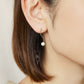 10K Akoya Pearl S-shaped Modern Earrings (Yellow Gold) - Model Image
