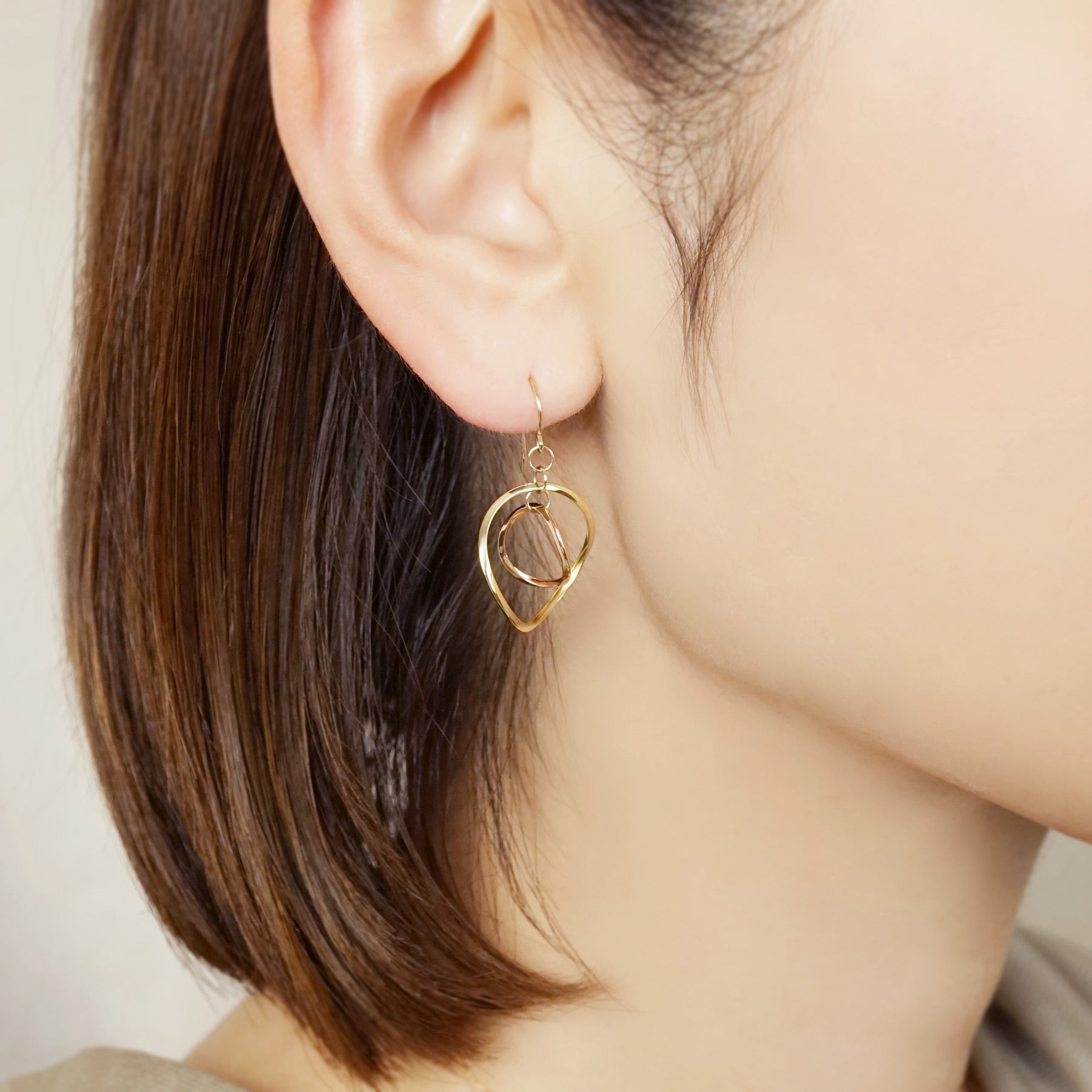 10K Twin Circle Swinging Earrings (Yellow Gold / Rose Gold) - Model Image